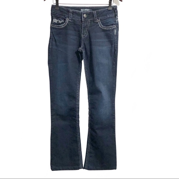 Silver “Suki” stretch, dark wash jeans.